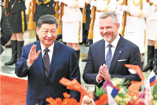 President Xi Jinping holds a welcoming ceremony for Slovak President Peter Pellegrini at the Great Hall of the People prior to their talks in Beijing on Tuesday. Pellegrini is on a state visit to China till Wednesday. WANG ZHUANGFEI / CHINA DAILY